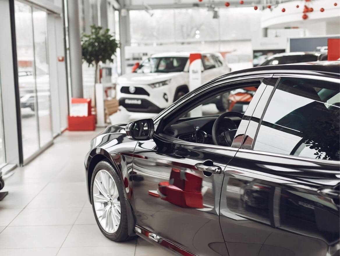 Professional car dealer at dealership